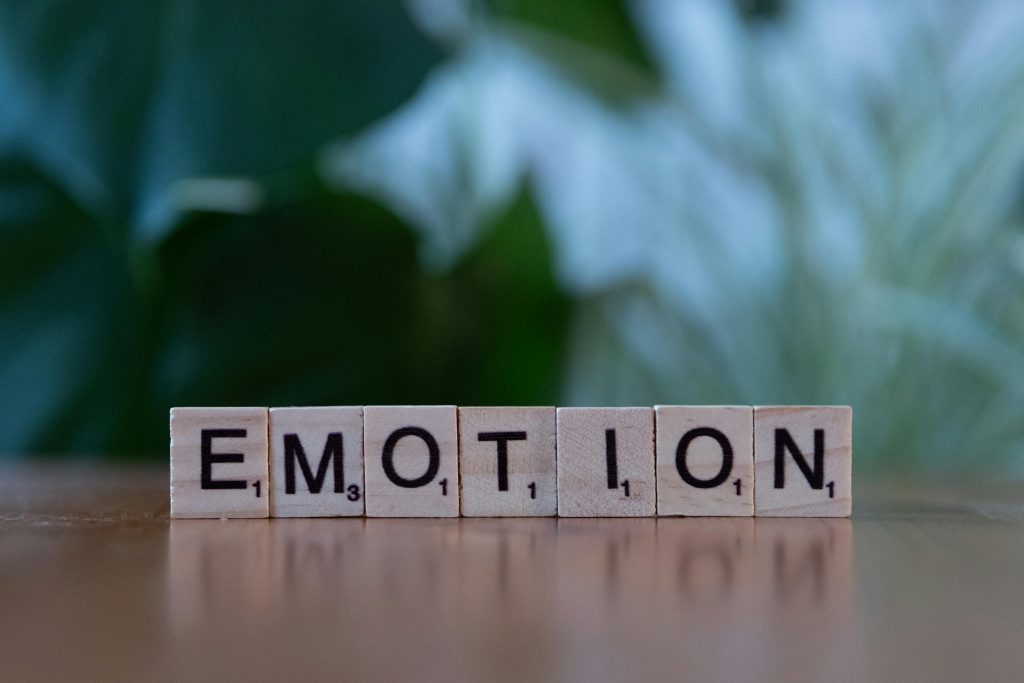 pexels photo 30901681 30901681 Wooden Scrabble tiles spelling 'Emotion' with a natural blurred background.