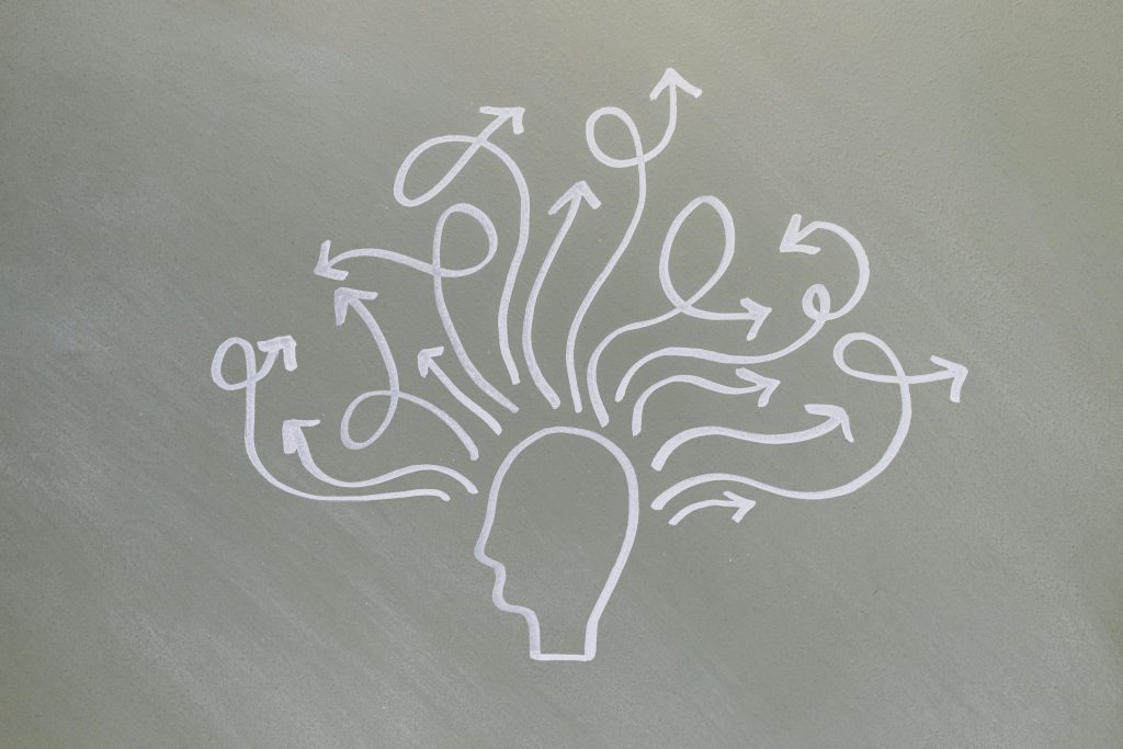 pexels photo 8378723 8378723 Conceptual chalk drawing illustrating mental health challenges with arrows representing thoughts.